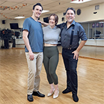 George posing with a couple in the studio after first dance wedding lessons